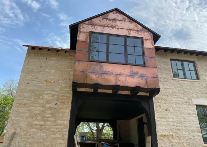 Copper metal panel facade on a stone building for Metal Roof Coating in Palm Desert
